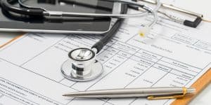stethoscope on medical bill