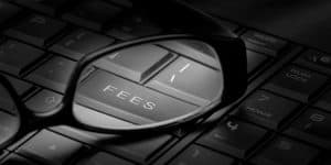 glasses on computer keyboard magnifying key labeled "feels"