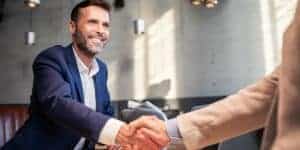 Business people shaking hands during meeting