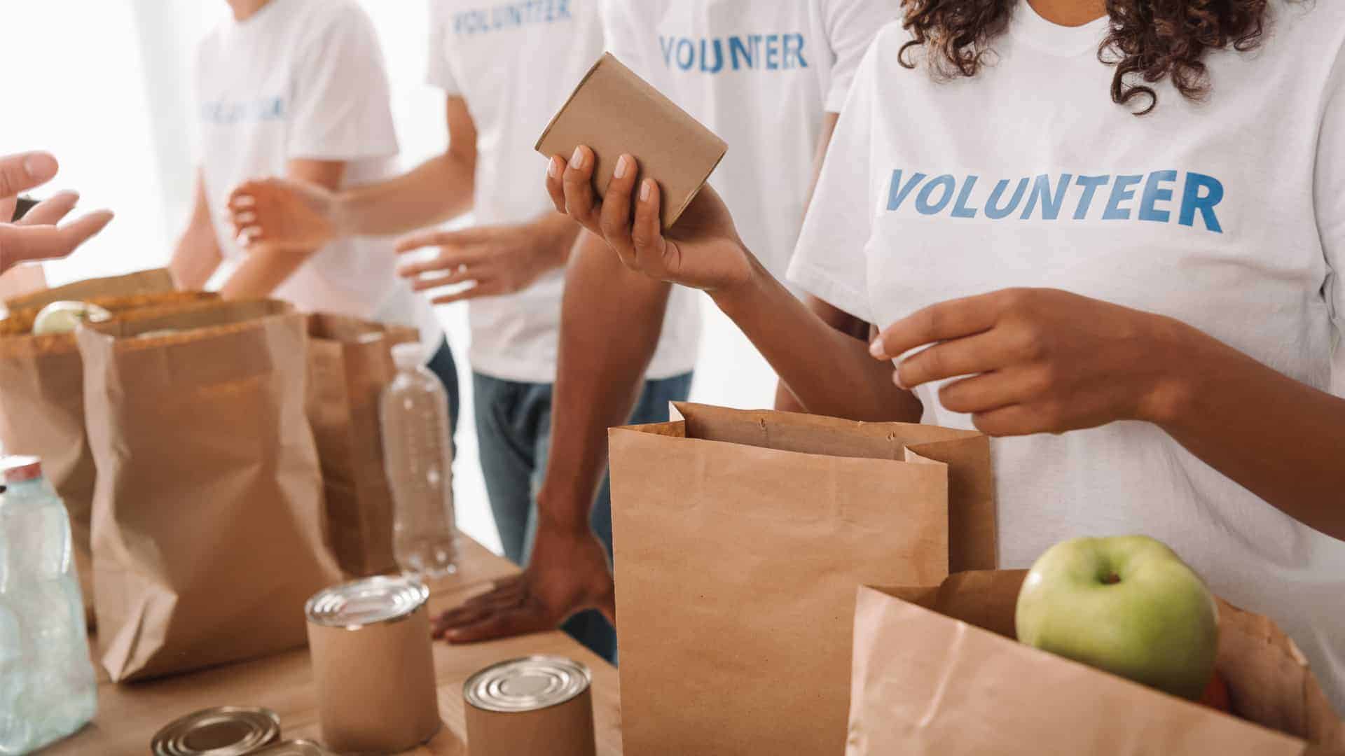 volunteers packing food and drinks for charity