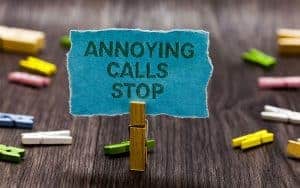 A clip holding a paper stating annoying calls stop
