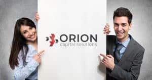 Two young professionals pointing towards Orion capital solutions logo