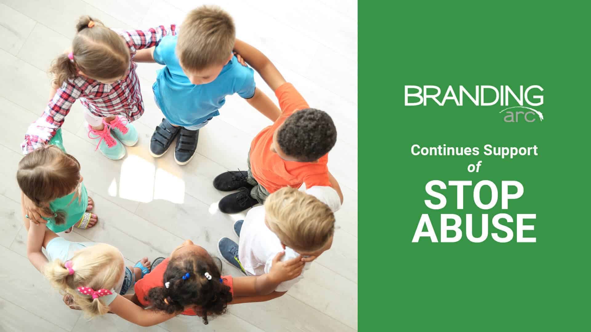 A group of children holding each other in a circle