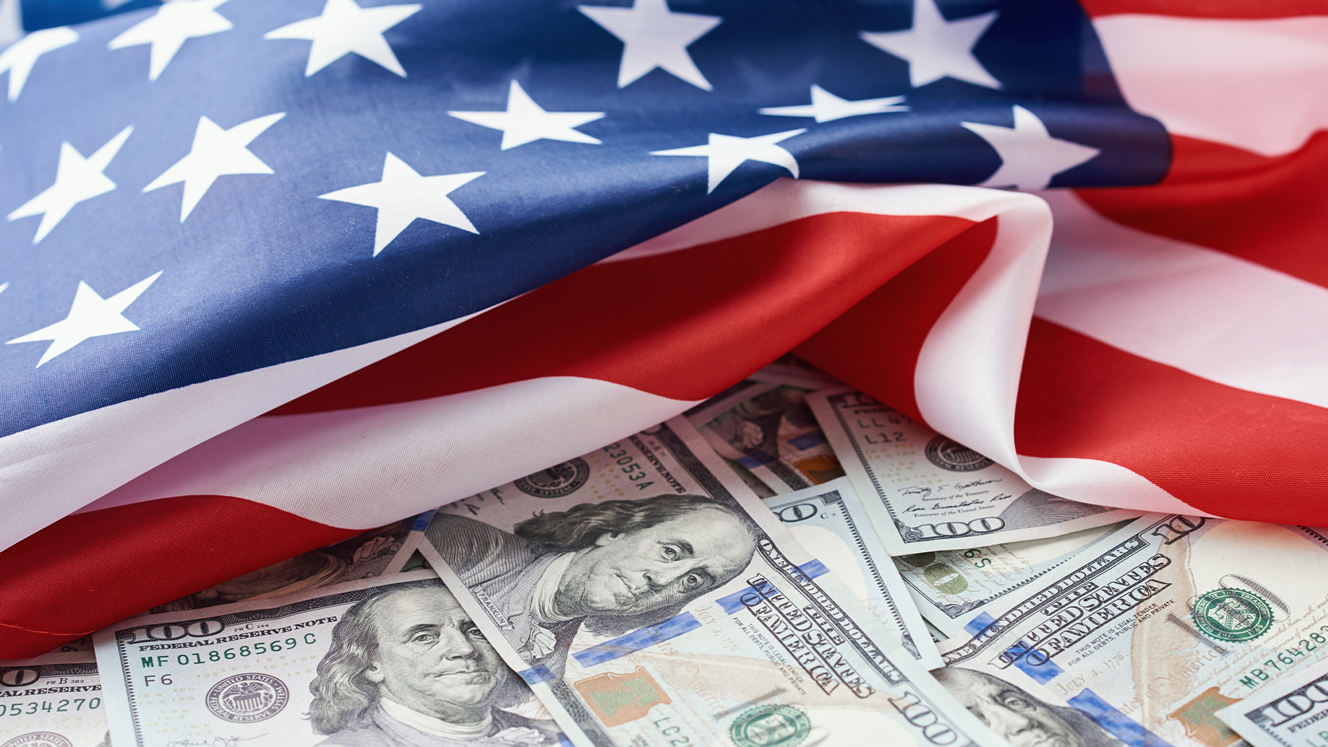 USA national flag and the dollar bills. Business and finance concept